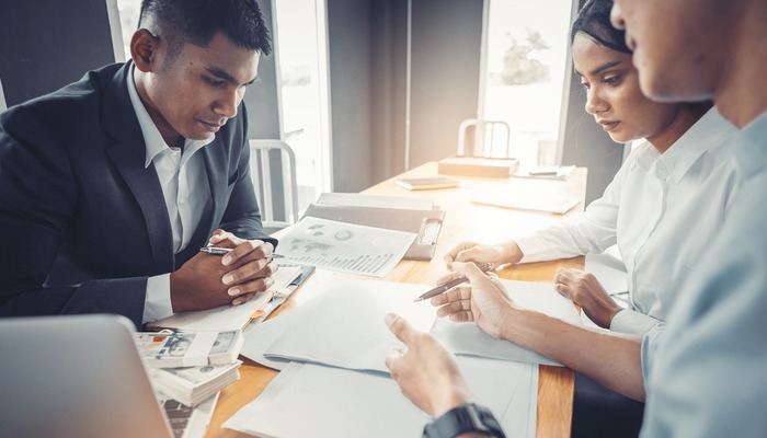 Loan manager going through application with business owners