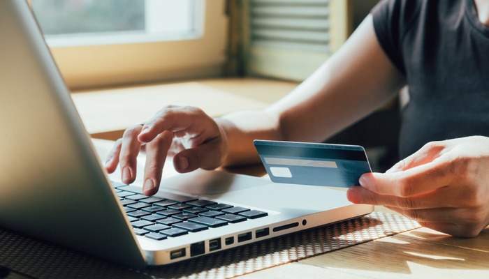 Person using a credit card to make a purchase online