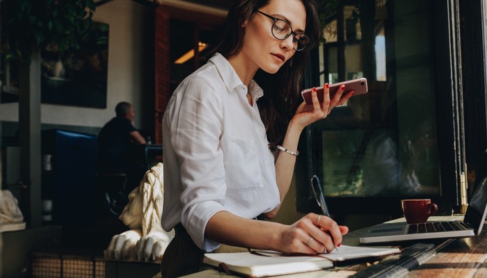 Female business owner multitasking