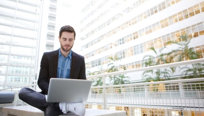 Young Business Man Using Laptop